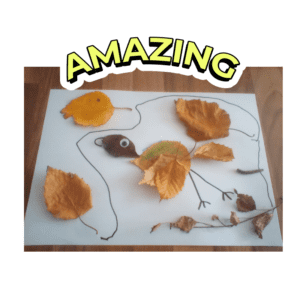 Children's picture of a bird using leaves on white paper.